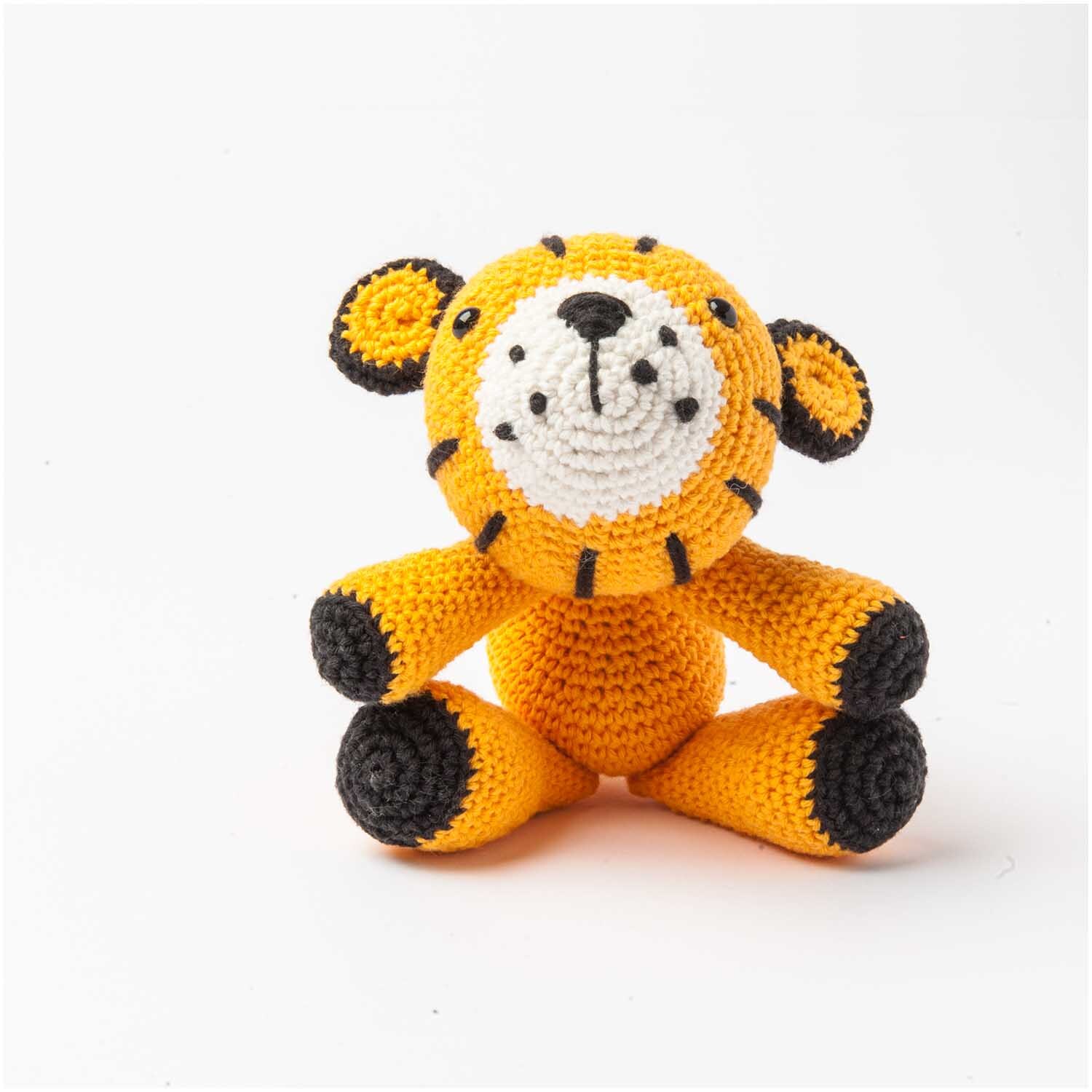 Häkelset Ricorumi Puppies Tiger: Ein niedlicher, gehäkelter Tiger in leuchtendem Orange von Rico Design.