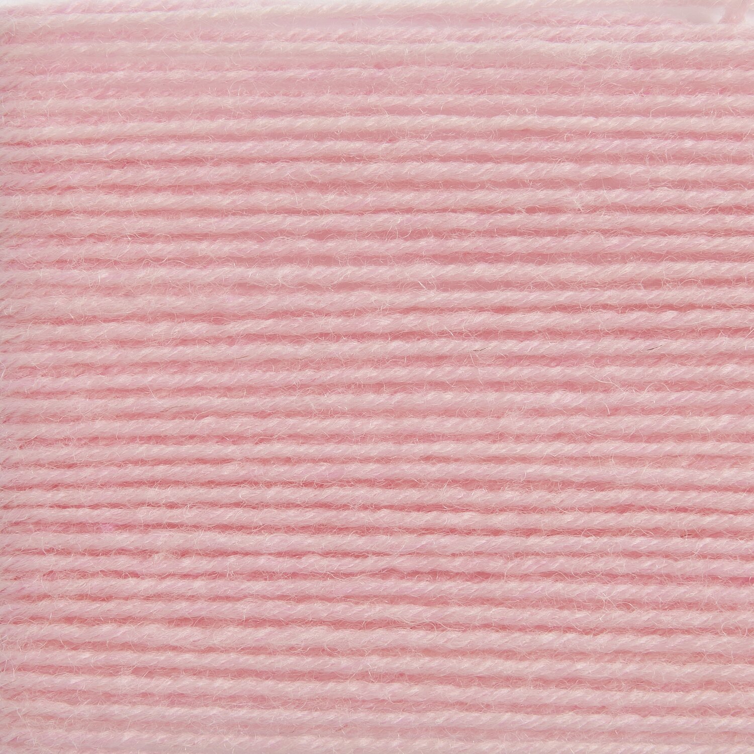 Sockenwolle Premium 4-fädig in zartem Rosa von Rico Design, 100g 380m, ideal für Strickprojekte.