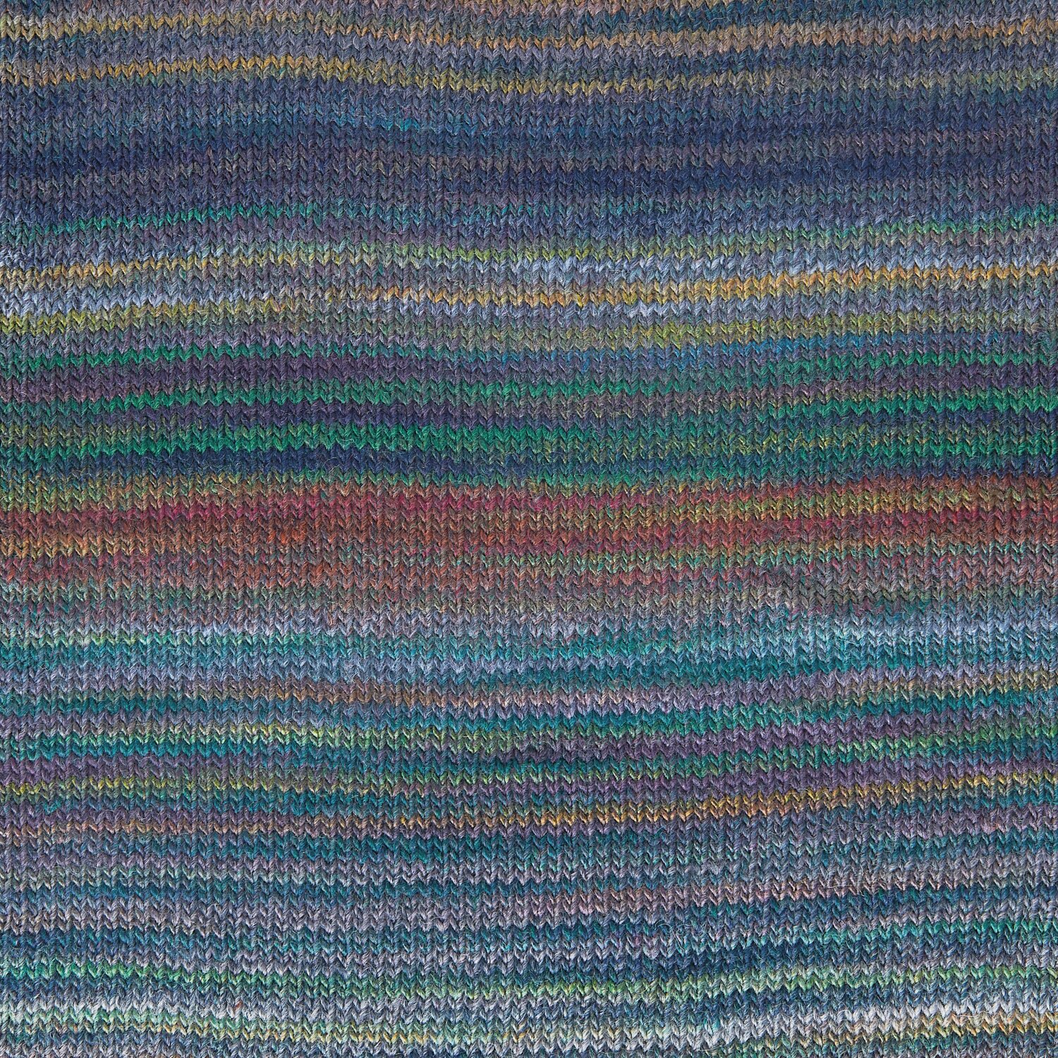 Creative Melange aran Wonderball, gestrickt in Blau-Grün, zeigt ein harmonisches Farbspiel.