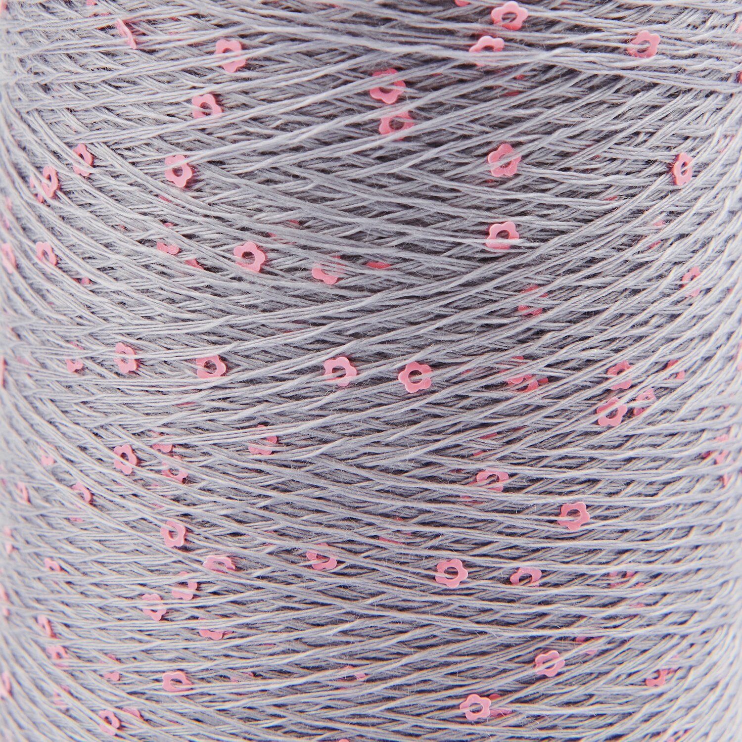 Creative Make It Blümchen: Graues Garn mit rosa Blümchenmuster, 25g 375m, von Rico Design.