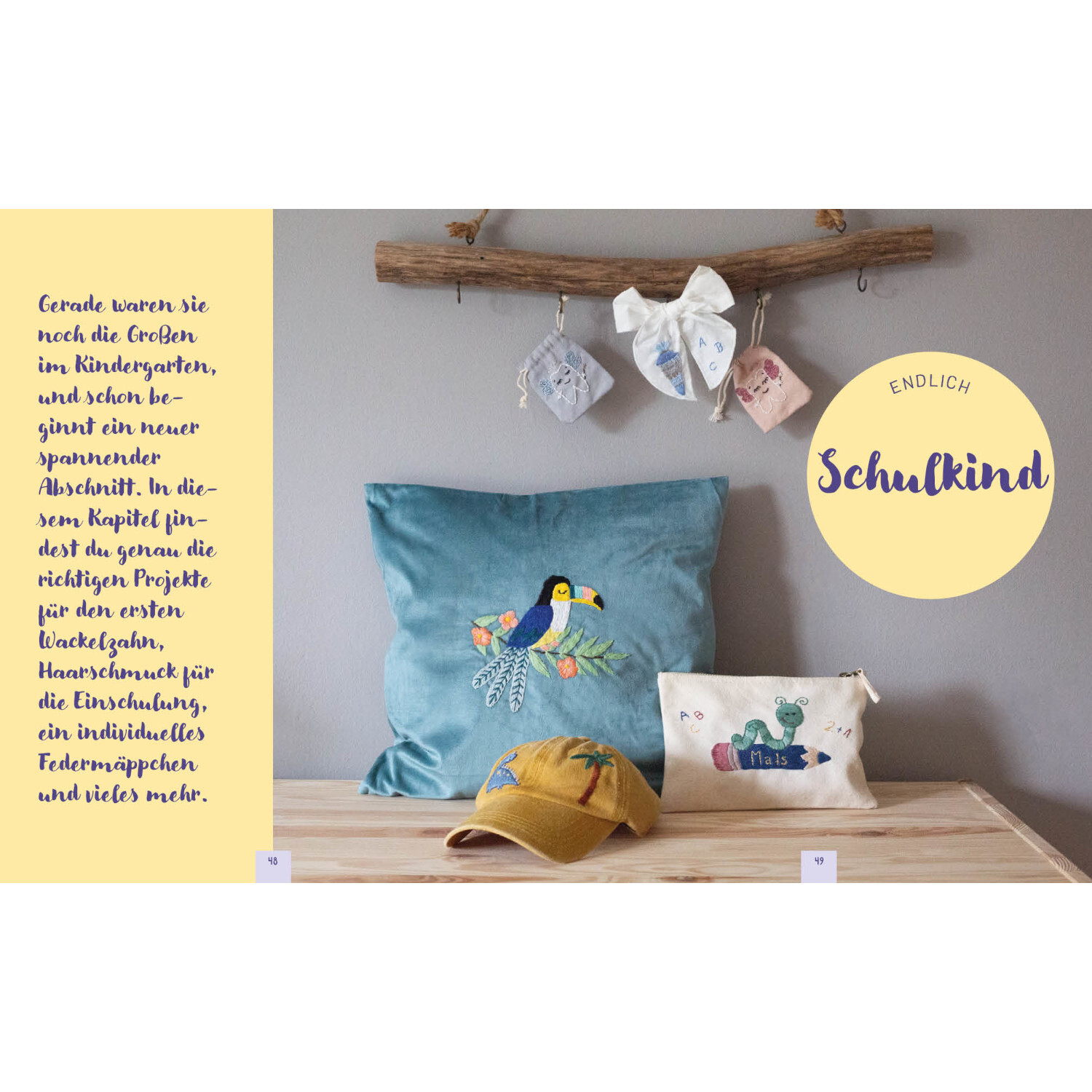 Hello Little One – Süße Stickmotive: Dekoratives Kissen mit Vogelmotiv, gelbe Kappe und besticktes Etui auf Holzbank.